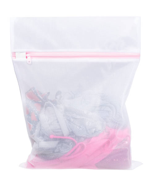istock Clothing in high quality white laundry bag. 1140719845