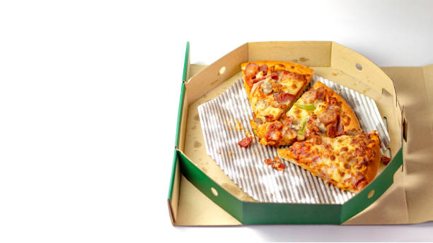 istock The remaining pizza is in the box.Empty pizza box with three slice remains. Top view 1140722970
