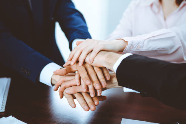 istock Business people group joining hands. Teamwork or meeting concepts 1140723260