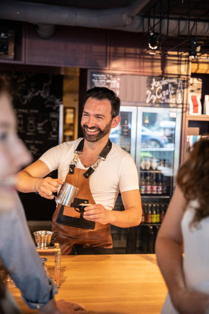 istock Man cafe owner at work behind the counter 1140725406