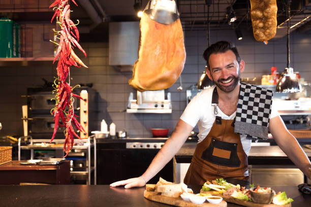 istock Man cafe owner at work behind the counter 1140726270