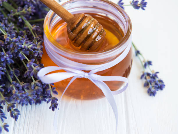 istock Jar with honey and fresh lavender flowers 1140727136