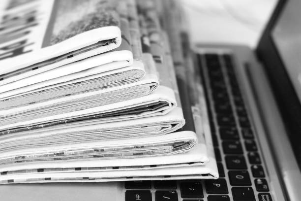 istock Newspapers and Laptop 1140727184