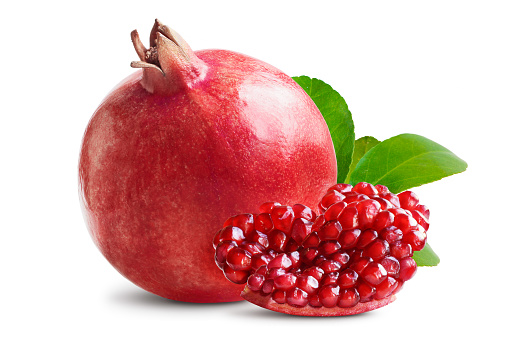 Pomegranate Composition. Whole and Cut Pomegranate Isolated on White. Full Depth of Field
