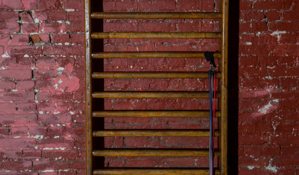 istock Wooden Ladders On Wall In Gym 1140728074