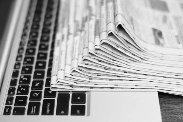 istock Newspapers and Laptop 1140728179