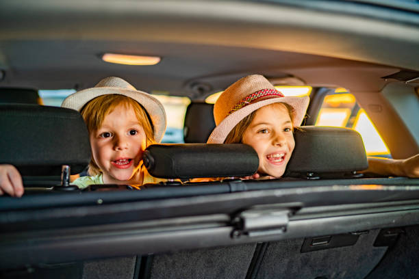 istock Portrait little kids playing in car 1140735870