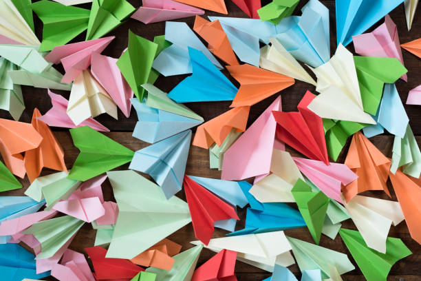 istock High Angle View Of Multi Colored Paper Airplane On Table 1140736420