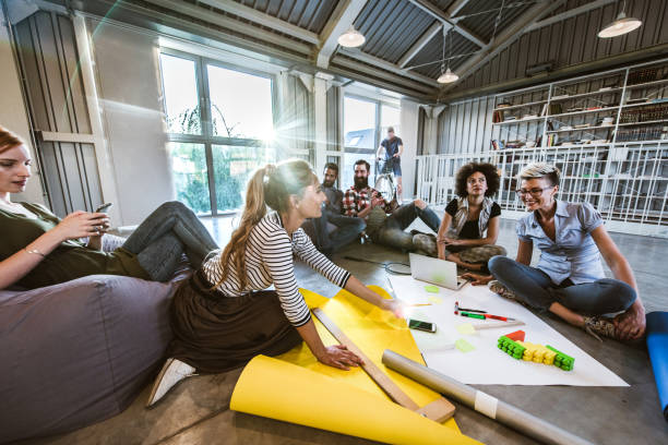 istock Large group of relaxed entrepreneurs working at casual office. 1140743812