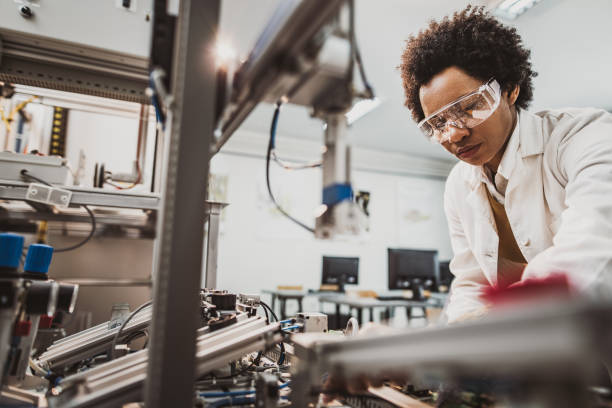 istock Black female engineer working on industrial machine in a laboratory. 1140744776
