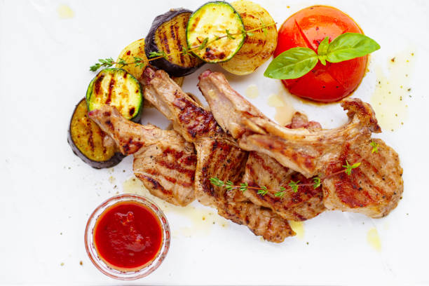 istock grilled lamb ribs loin with vegetable garnishing 1140744804