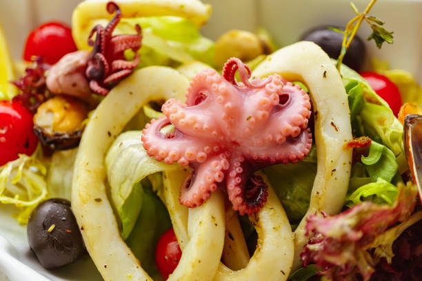 istock fish restaurant menu, fresh salad with seafood 1140744821