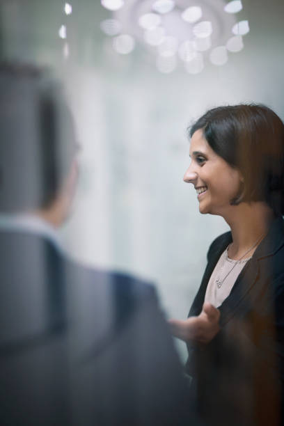 istock Woman talking in office social gathering 1140745290