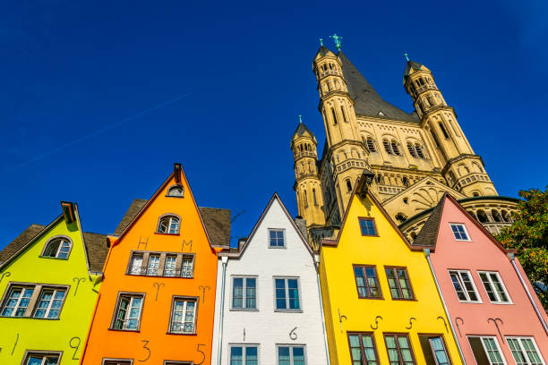 Colorful facades and spire of the Saint martin church in cologne, Germany Colorful facades and spire of the Saint martin church in cologne, Germany tarde stock pictures, royalty-free photos & images