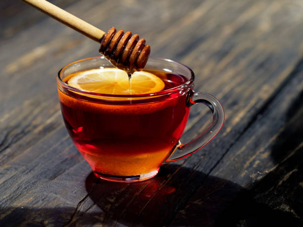 istock Honey is pouring into the cup of tea 1140746545
