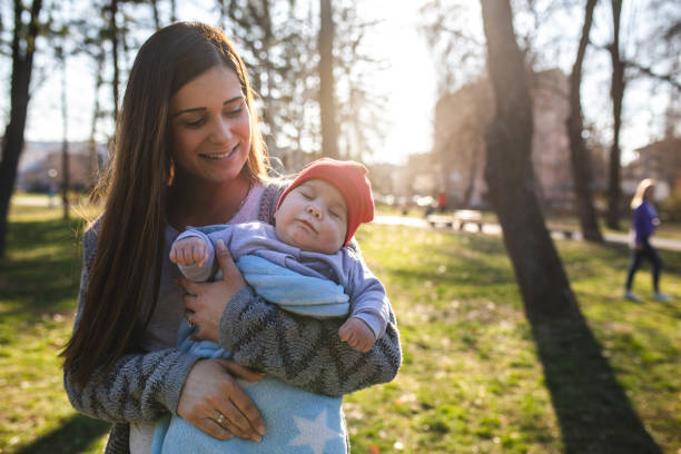 istock Gorgeous mother and a cute sleeping baby 1140747716