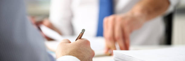 istock Clerk man at office workplace with silver pen in arms 1140748024