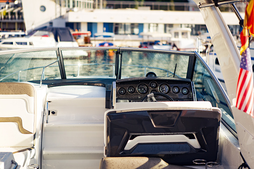 Inside of a speed boat anchored in a marina.