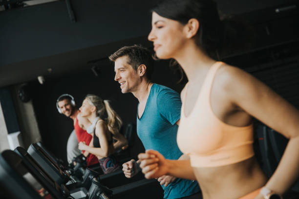 istock young people running on treadmills in modern gym 1140748786
