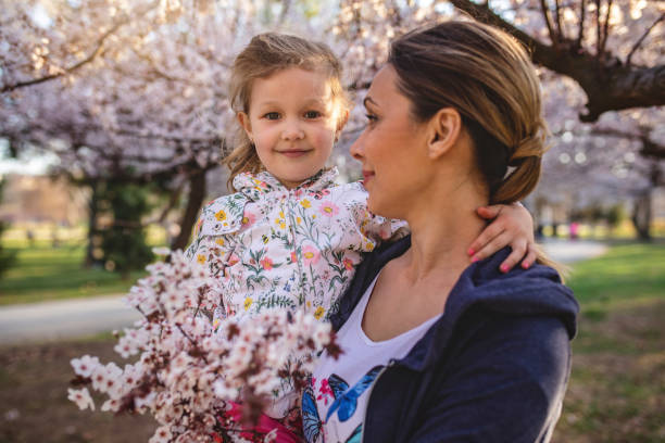 istock Cute innocent child and her mother in Spring 1140748944