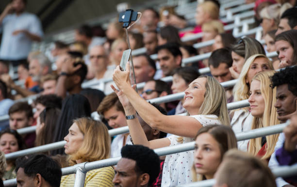 istock Friends Taking A Selfie On Stadium Bleachers 1140749175