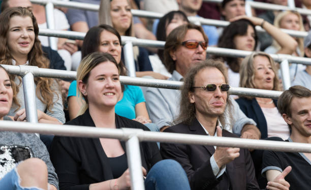 istock Sport Fans Cheering On Tribunes 1140749200