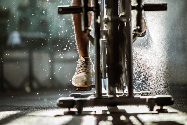 istock Unrecognizable athletic man having cross training on exercise bike in a gym. 1140749205