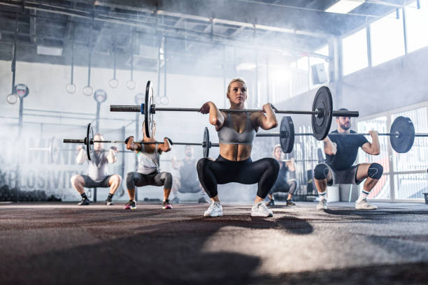 istock Large group of athletes having weight training in a gym. 1140749458