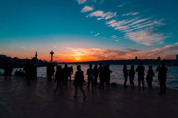 istock People watching the sunset in city 1140749724