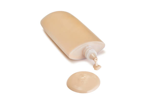 istock Round face make-up liquid foundation sample on a white background, dripping from a plastic container, with nice shadow, clipping path included 1140750446