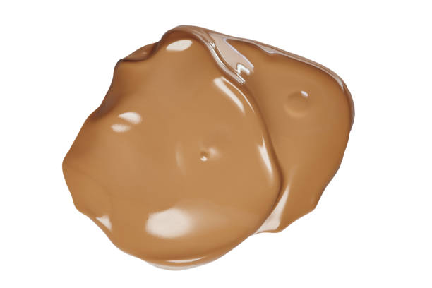istock Smeared face make-up creme foundation sample with lighter reflections, on a white background, clipping path included 1140750461
