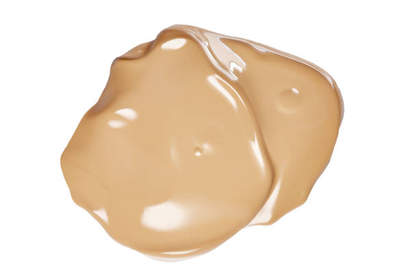 istock Smeared face make-up creme foundation sample with lighter reflections, on a white background, clipping path included 1140750495