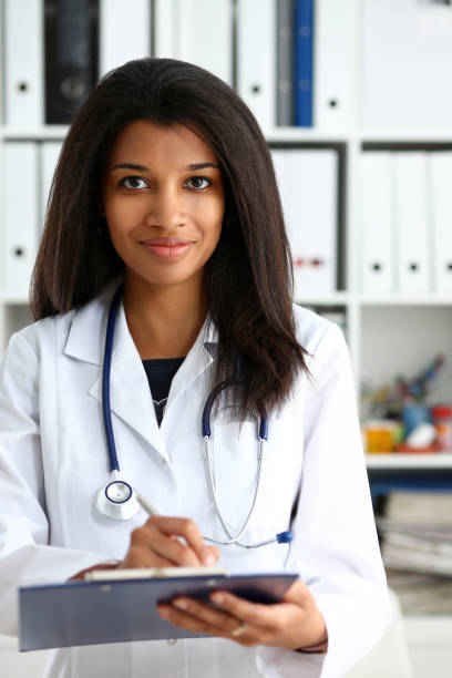 istock Beautiful smiling female doctor hold 1140751284
