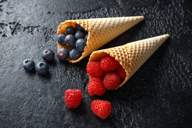 istock Fresh Blueberries, Raspberries, strawberries in waffle cones. 1140752423