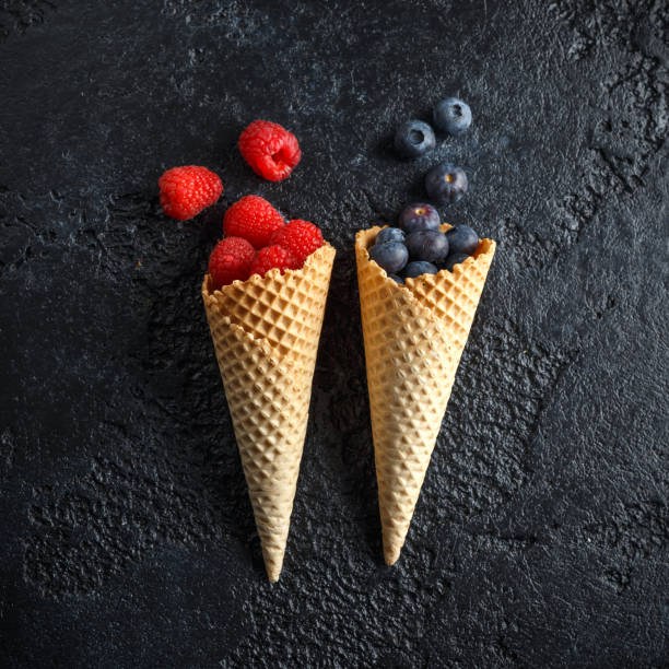 istock Fresh Blueberries, Raspberries, strawberries in waffle cones. 1140752444
