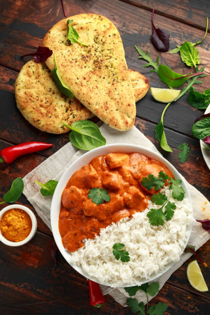istock Chicken tikka masala curry with rice and naan bread 1140752856