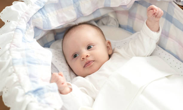 istock Baby girl in her crib 1140756005