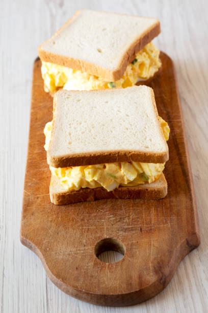 istock Homemade egg sandwich for breakfast over white wooden surface, low angle view. Close-up. 1140756049