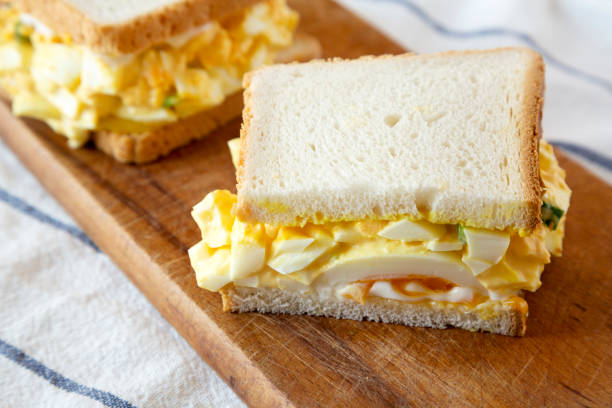 istock Homemade egg sandwich for breakfast on rustic wooden board, side view. Close-up. 1140756108