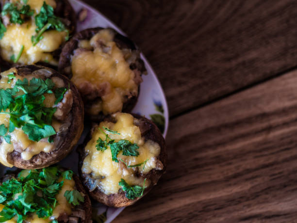istock Stuffed mushrooms on a rough wooden surface 1140757178