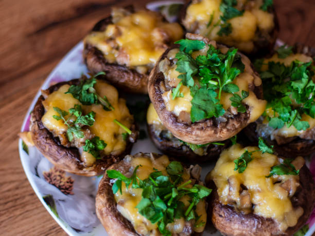 istock Stuffed mushrooms on a rough wooden surface 1140757196