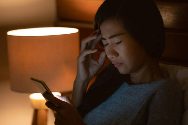 istock stress asian woman lying in bed using smartphone 1140757445