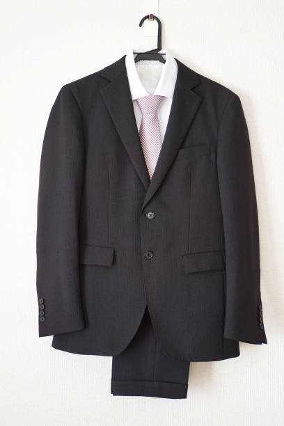 istock Black business suit and pink tie. 1140760049
