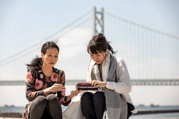 istock Women examining with smartphone 1140762407