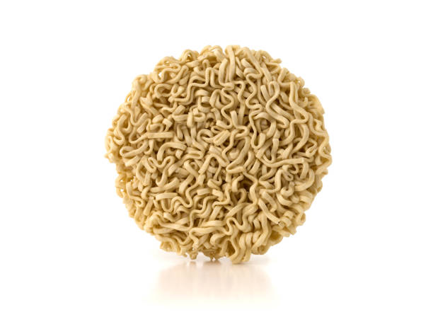 istock Egg noodles on a white background. Dry egg noodles close up on white background. 1140764042