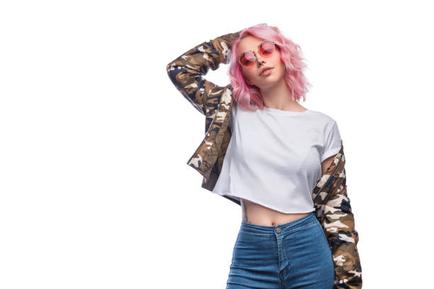 stylish female touching hair - shirt women pink jeans imagens e fotografias de stock