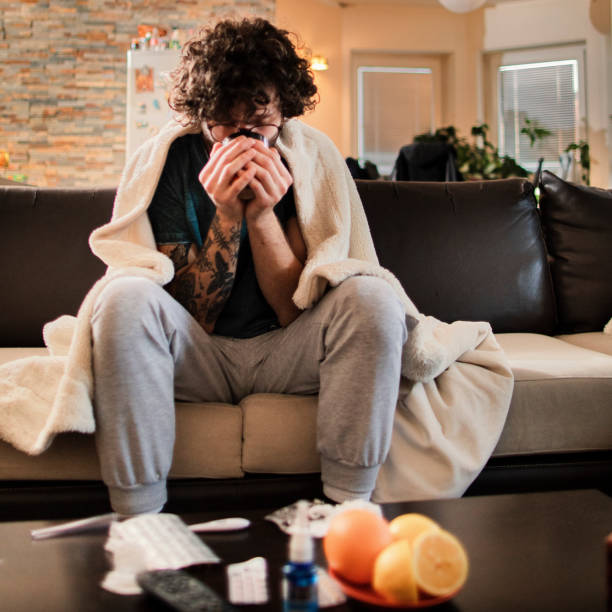 istock Sick At Home . Man having a cup of tea 1140765784