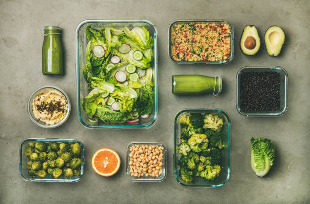 istock Healthy vegan dishes and drinks in bottle over concrete table 1140766346