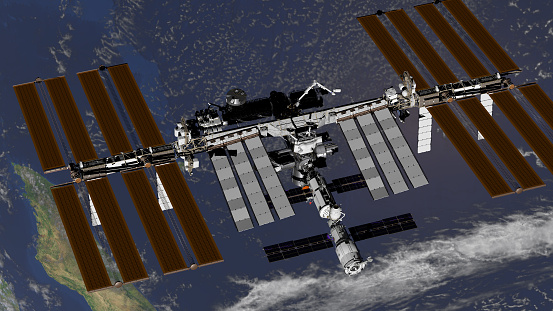 International Space Station ISS revolving over earths atmosphere. Elements of this image furnished by NASA. 3D rendering.