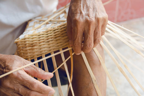 istock Senior man hands manually weaving bamboo. 1140768554